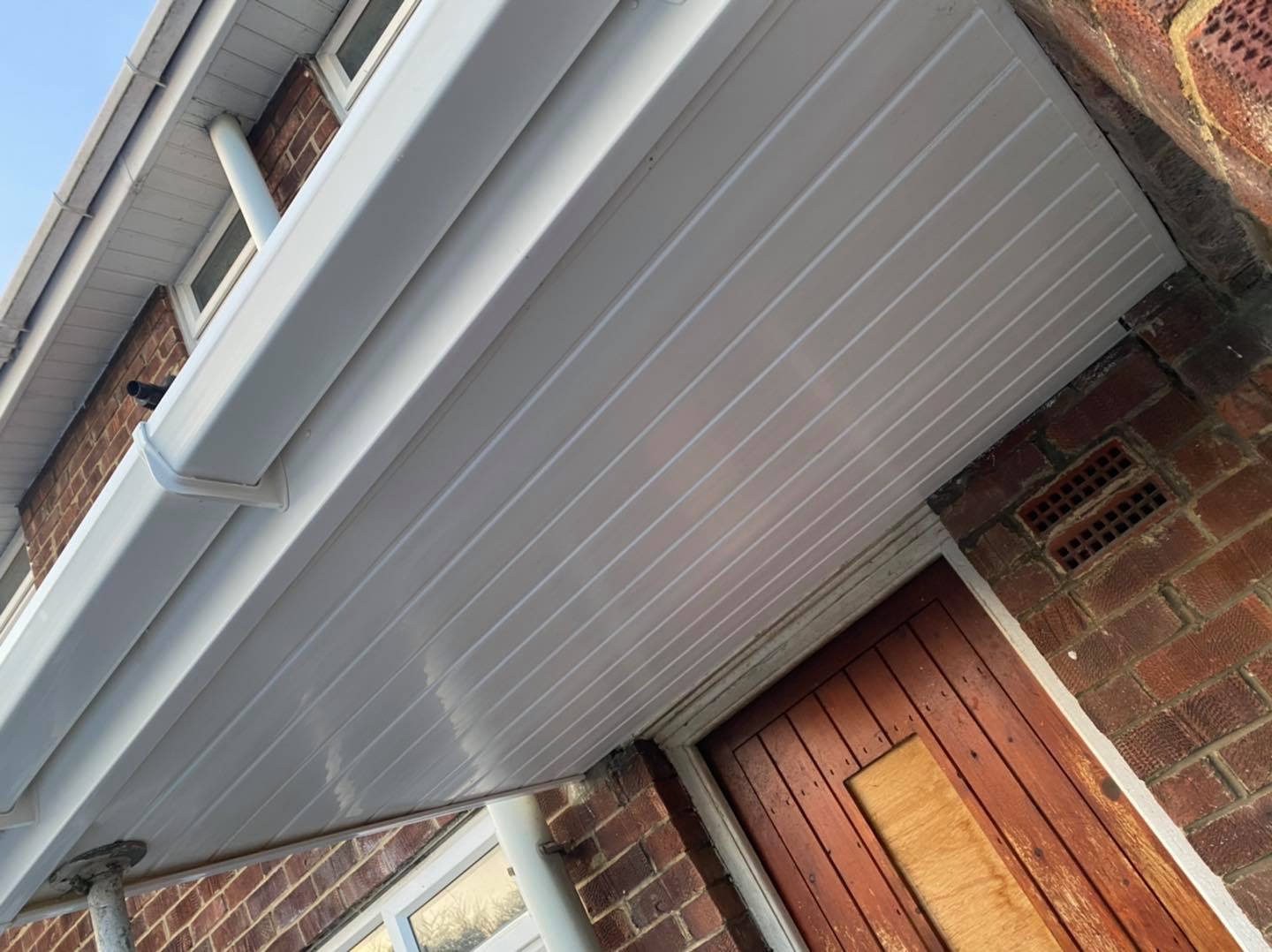 Clean white roofline cladding and soffit installation
