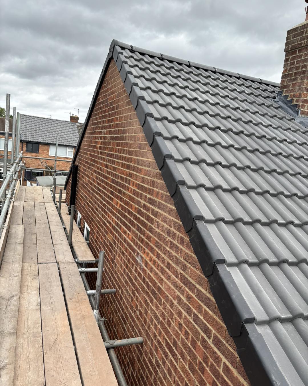 Completed grey tiled roof
