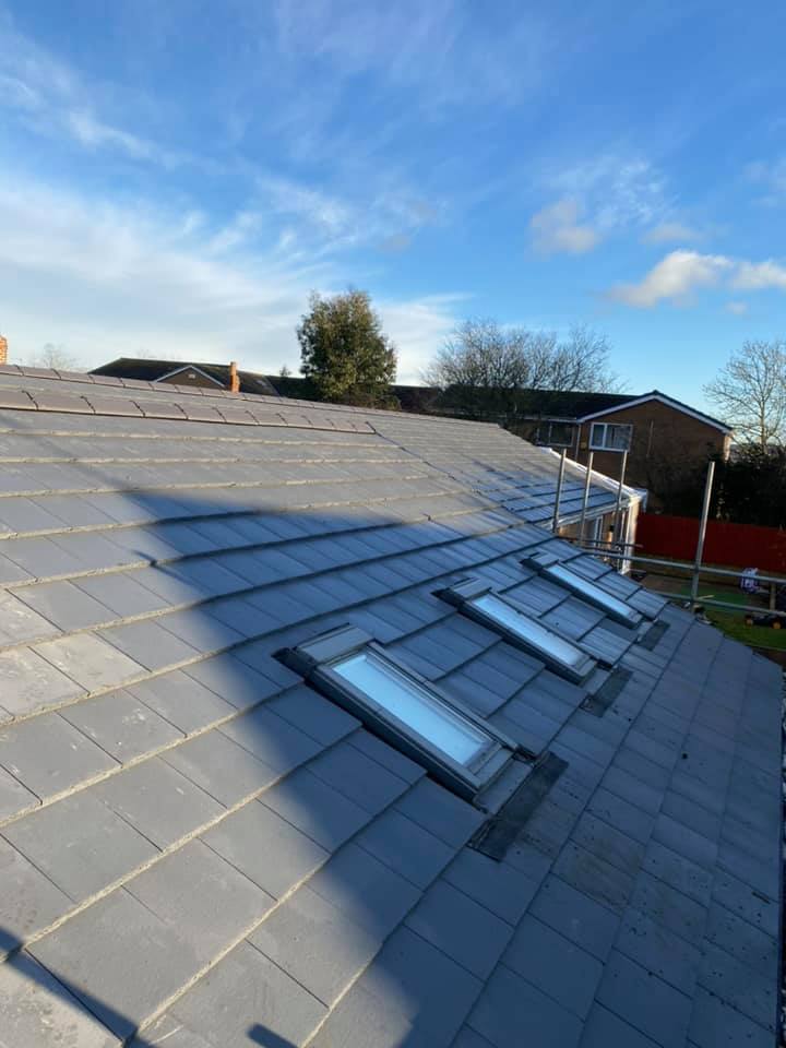 Two Velux roof windows installed within a tiled roof